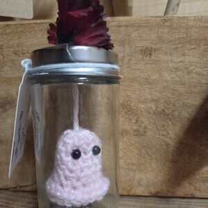 Crochet pink ghost in tall jar